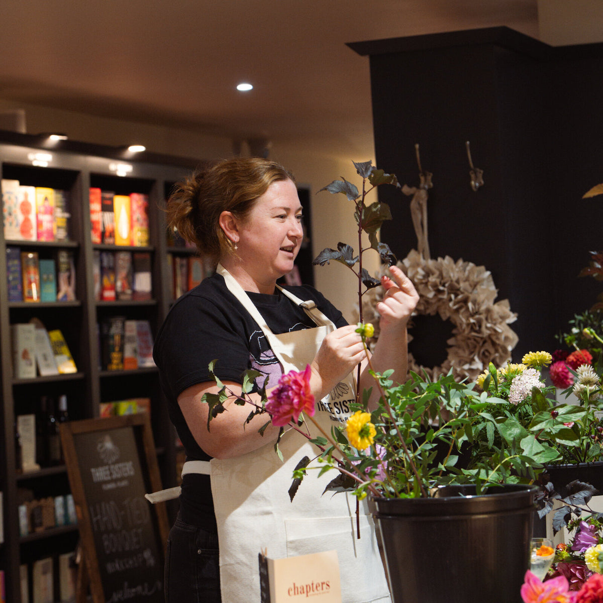 A florist from Three Sisters leading a flower workshop at Chapters